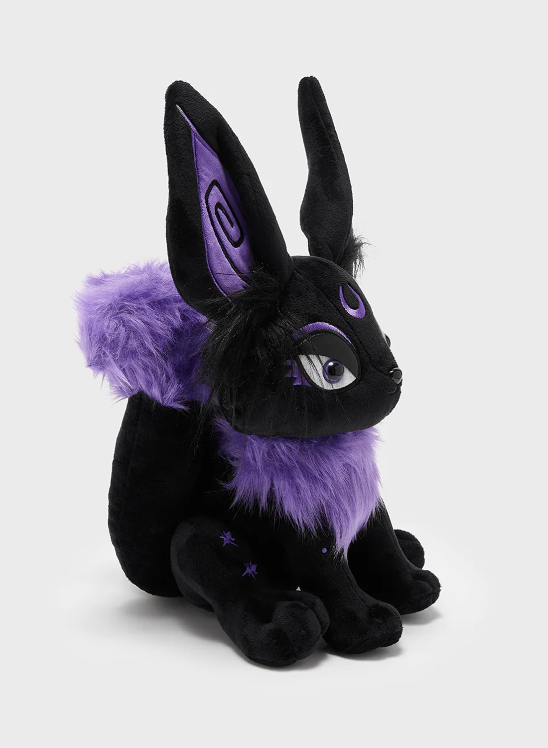 Black and purple Kitsune plush toy from Killstar with big ears, purple details and moon symbol on forehead