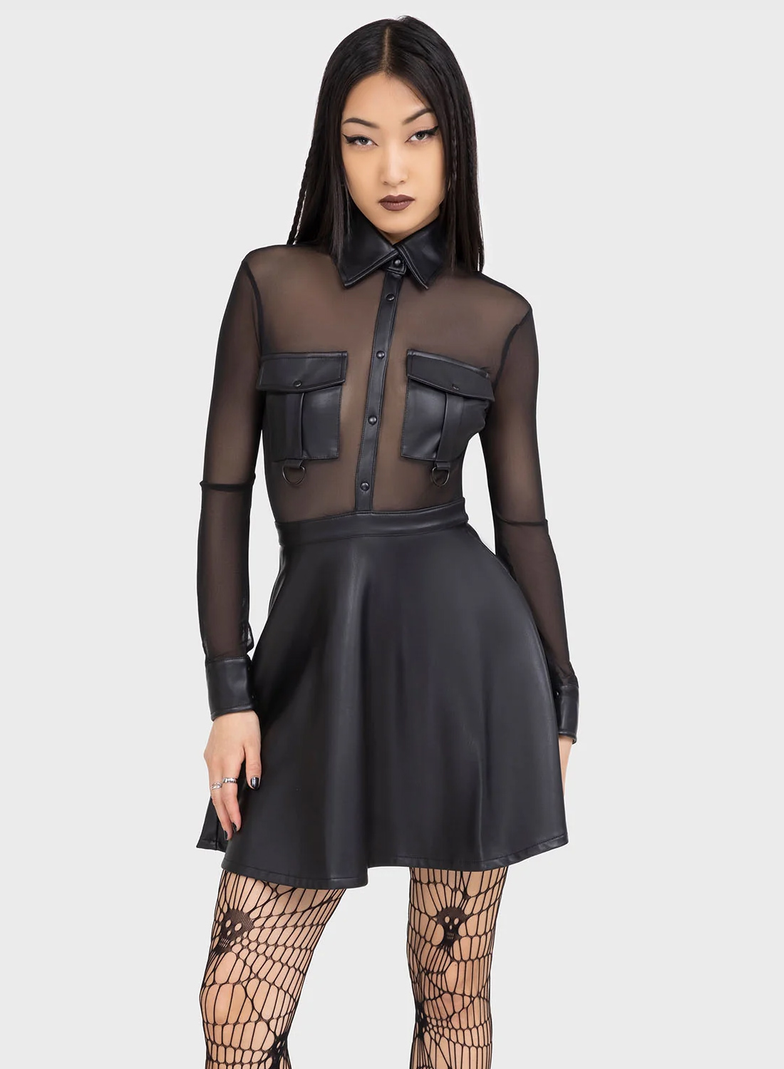 Killstar Shadowsinger Dress. Black mini dress with transparent mesh top and PU skirt, long sleeves and button details from Killstar.
