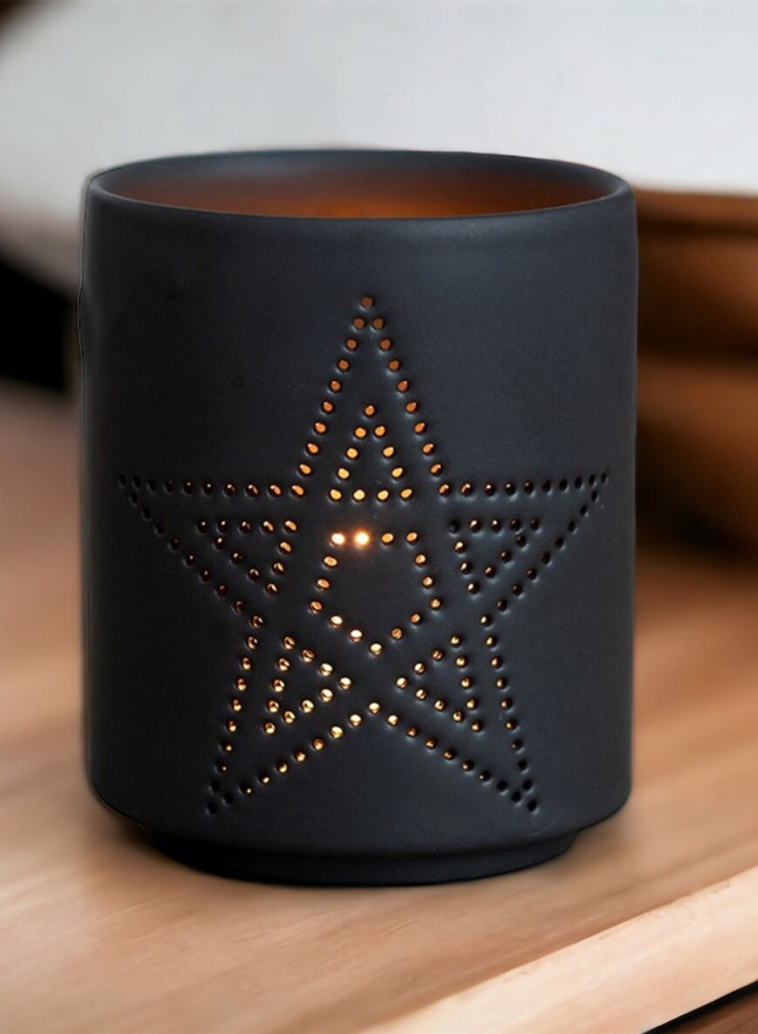 Pentagram Light Holder – black cylindrical light holder with a perforated pentagram that lets warm light through. Gothic decoration with matte finish.