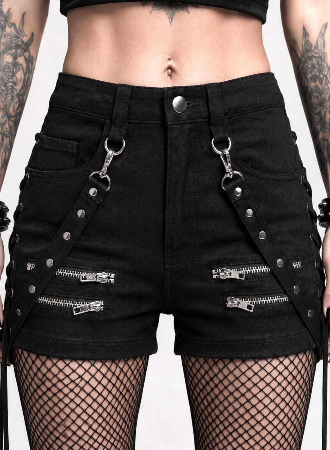 Black Bad Omens Shorts in stretch fabric with silver zippers, removable rivet straps and decorative lacing along the sides.