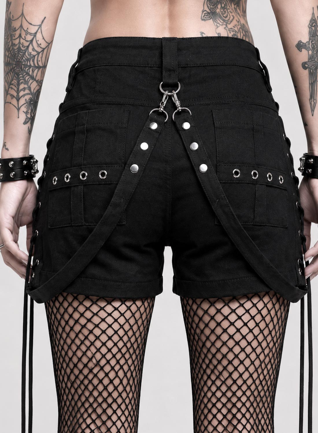 Black Bad Omens Shorts in stretch fabric with silver zippers, removable rivet straps and decorative lacing along the sides.